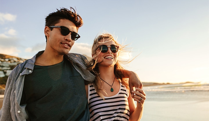 Young couple enjoying a summer day on seashore